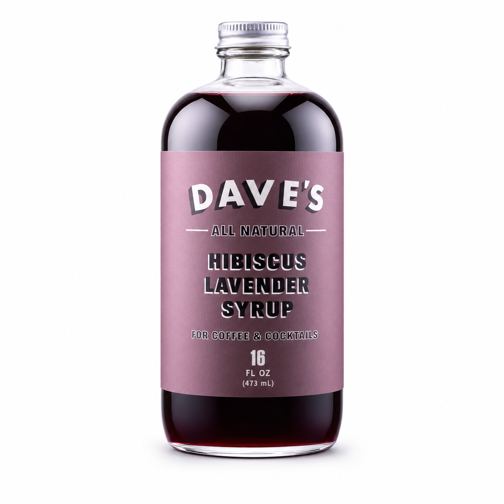 Clear 16 oz glass bottle of Dave's Hibiscus Lavender Syrup with a mauve label, filled with dark red syrup, on a white background